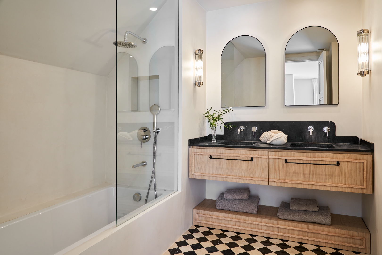 Master en-suite at Terraza Del Sol — bath, rain shower, double vanity and arched mirrors