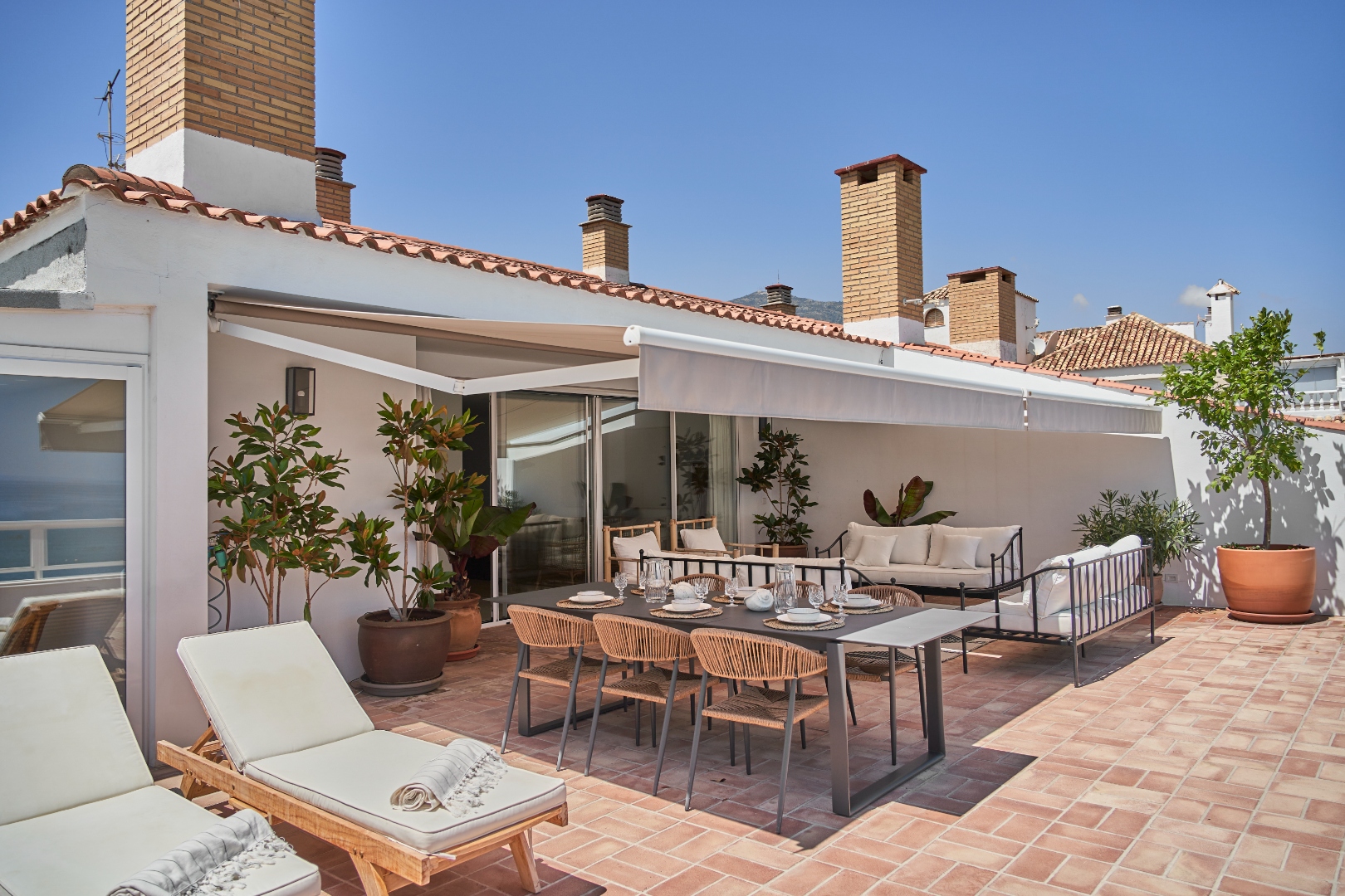 Terraza Del Sol terrace — full layout from inland side, awning retracted
